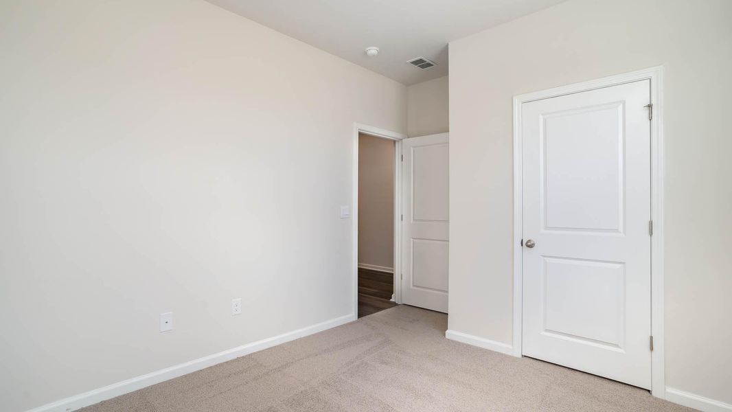 Representative unfurnished interior of a home built from the KERRY by D.R. Horton in Sandridge Park, Little River (Image 11).