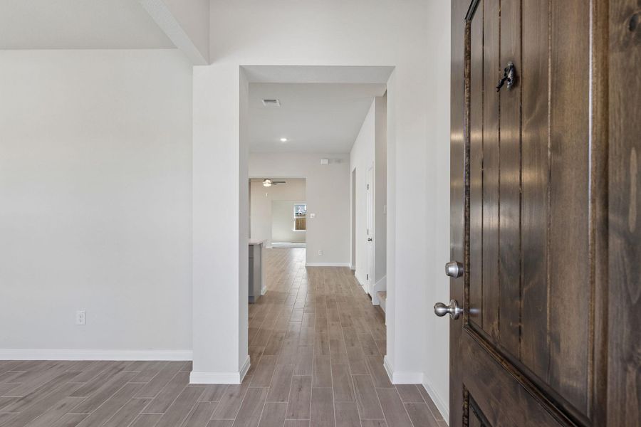 An inviting entrance foyer reveals a seamless flow into the main living spaces.