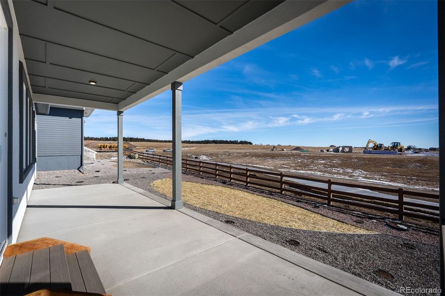 Exterior details and patio area of a home in Wolf Ranch - Enclave Collection, Colorado Springs (Image 24).