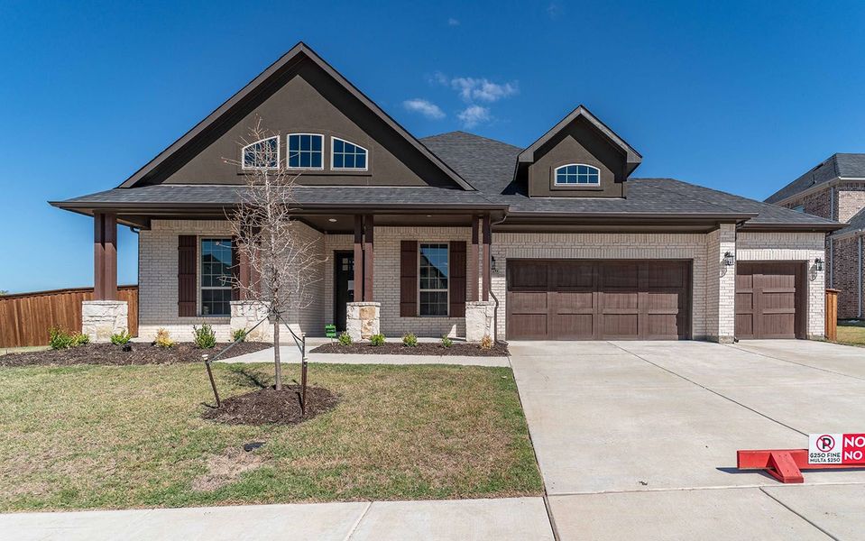 Front exterior of a new home in Sonoma Verde, Rockwall, TX, highlighting curb appeal (Image 1). Front exterior of a new home in Sonoma Verde, Rockwall, TX, highlighting curb appeal (Image 1).