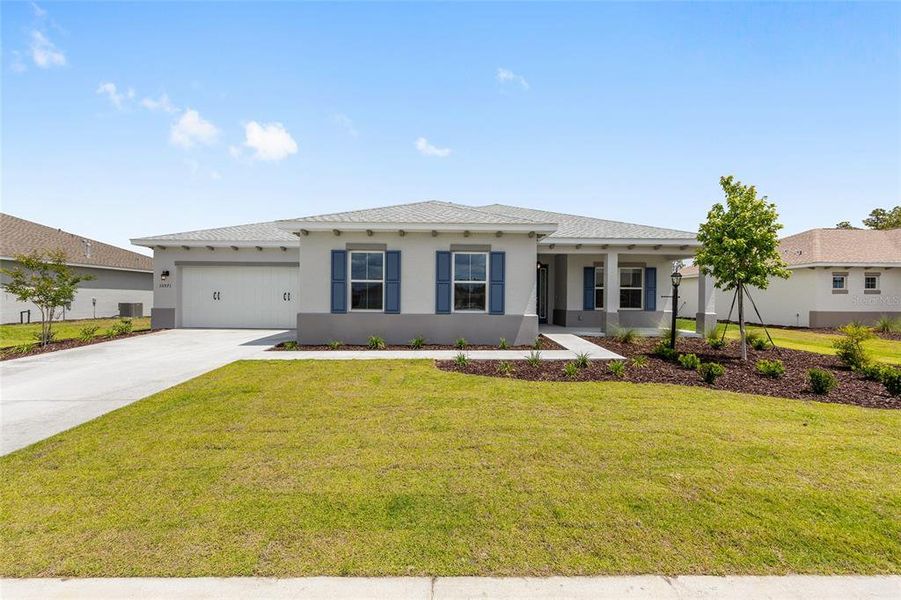 Front exterior of a new home in , Ocala, FL, highlighting curb appeal (Image 18). Front exterior of a new home in , Ocala, FL, highlighting curb appeal (Image 18).