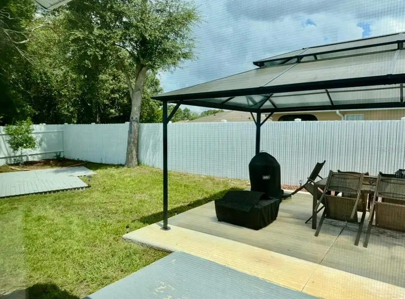 Exterior details and patio area of a home in , Ocala (Image 18).