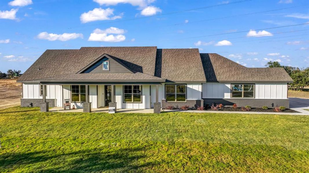 Front exterior of a new home in Saddle Crest Estates, Weatherford, TX, highlighting curb appeal (Image 1). Front exterior of a new home in Saddle Crest Estates, Weatherford, TX, highlighting curb appeal (Image 1).
