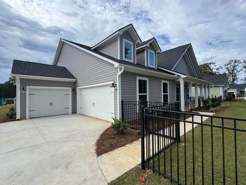 Front exterior of a new home in Central Estates, Summerville, SC, highlighting curb appeal (Image 4).