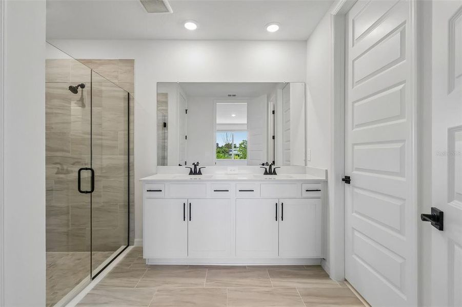 Furnished interior view inside a new home in The Grove at Stuart Crossing - Signature Series, Bartow (Image 14).