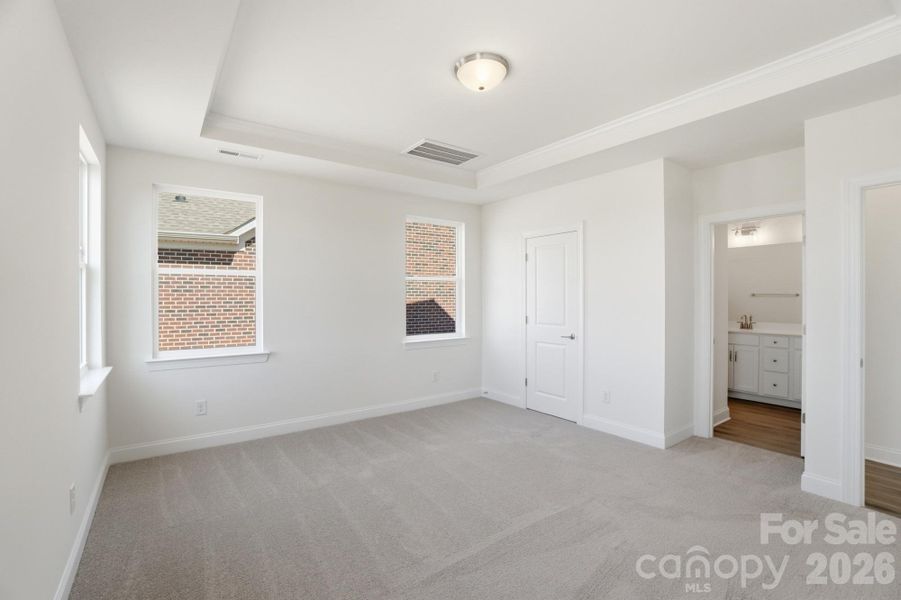 Primary Bedroom w/ tray ceiling