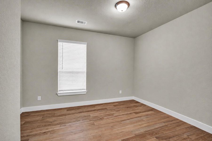 Secondary bedroom located at the front of the home Secondary bedroom located at the front of the home