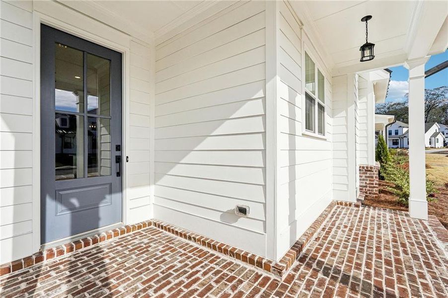Exterior details and patio area of a home in Promenade at Sawnee Village, Cumming (Image 4).