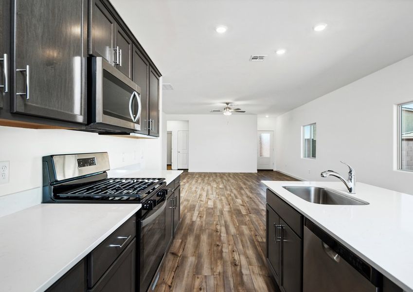 The kitchen flows directly into the living space for convenience and functionality.