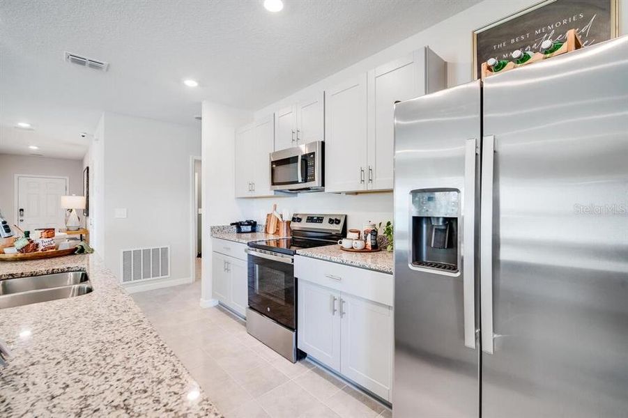 Furnished interior view inside a new home in Waterstone, Groveland (Image 8).