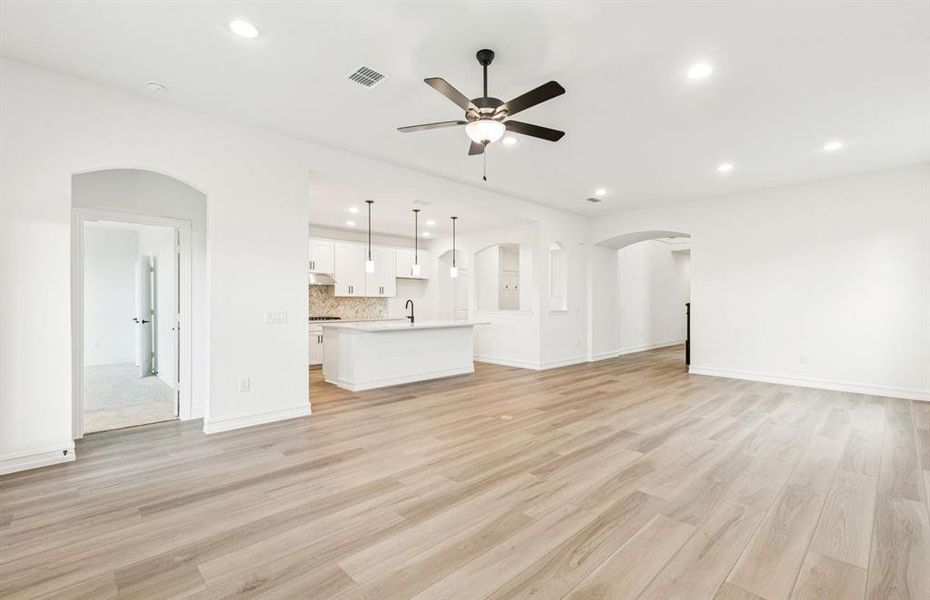 Open concept gathering room creating a spacious and inviting atmosphere  *Real home pictured