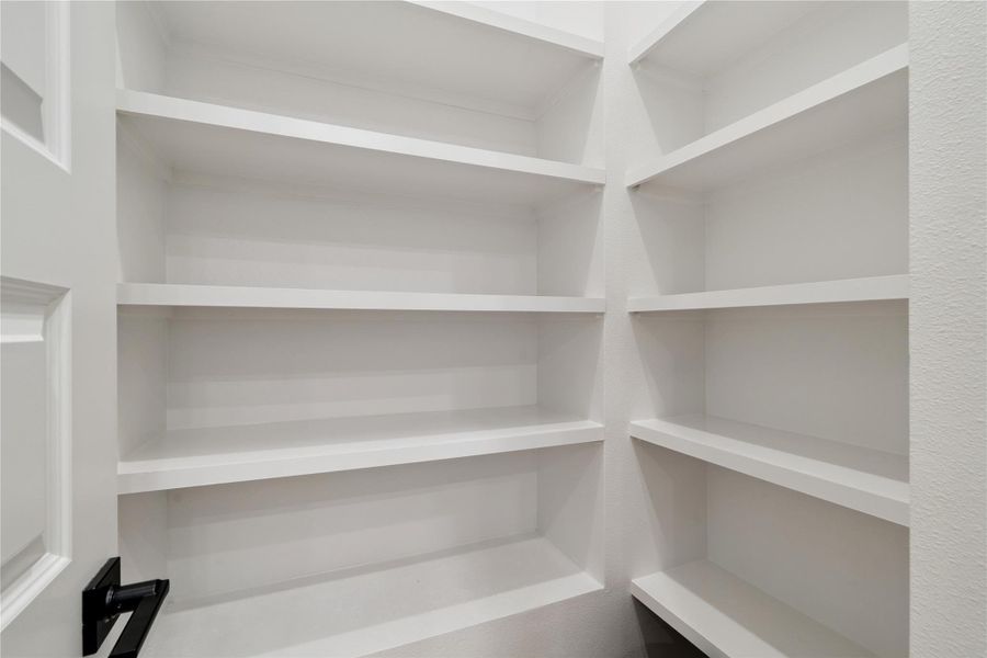 Open shelving allows the space to breathe while enhancing both practicality and minimalism.