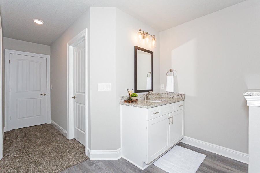 Representative furnished interior of a home built from the The Turquoise by Herbst Homes in Clear Water Landing, Milton (Image 65).