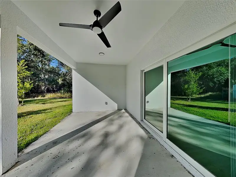Exterior details and patio area of a home in , Port Charlotte (Image 3).