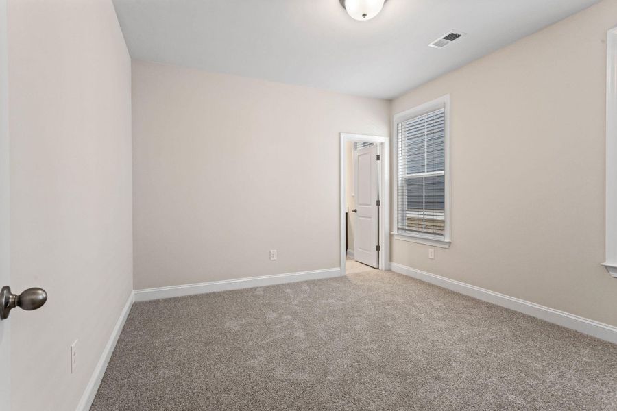 Spacious, unfurnished interior of a new home in Tidewater at Lakes of Cane Bay, Summerville (Image 22).