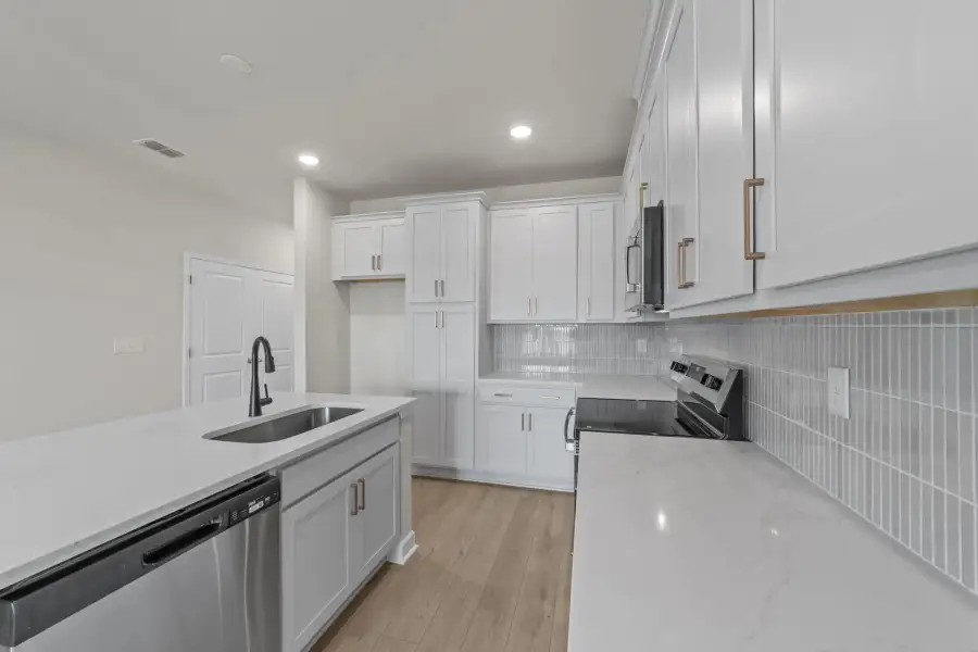 Sample Kitchen photo. Actual structural options and design finishes of home may vary.