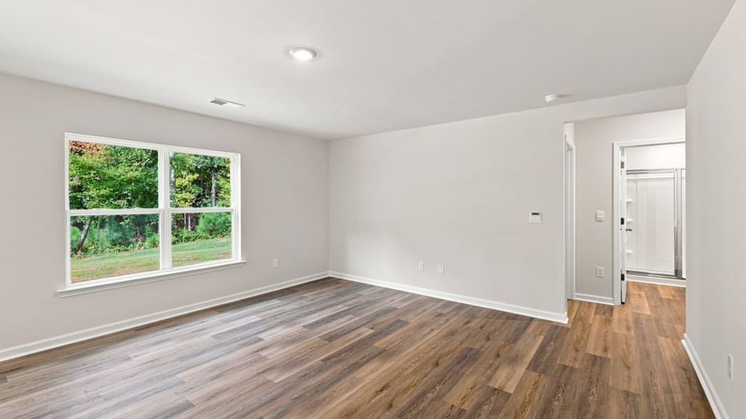 Spacious, unfurnished interior of a new home in Bentley Park, Greenwood (Image 18).