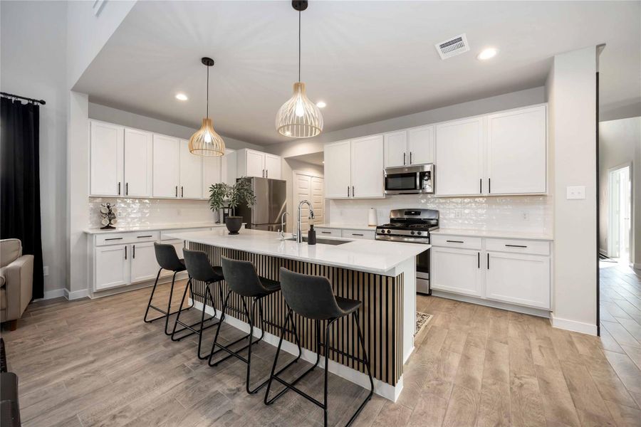 Gourmet kitchen with large island and quartz countertops. Gourmet kitchen with large island and quartz countertops.