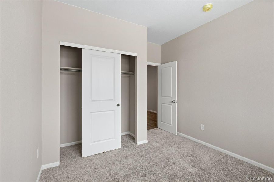 Spacious, unfurnished interior of a new home in The Cottages Collection at Ridgeline Vista, Brighton (Image 18).