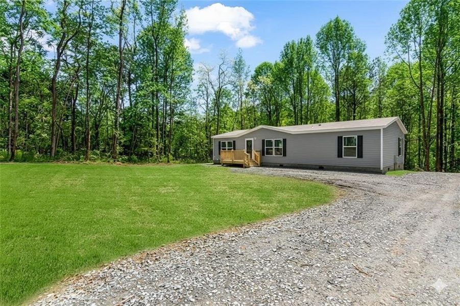 Exterior details and patio area of a home in , Ellijay (Image 26).