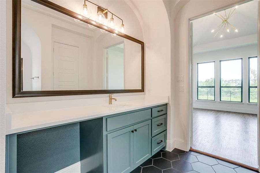 Bathroom with vanity and tile floors