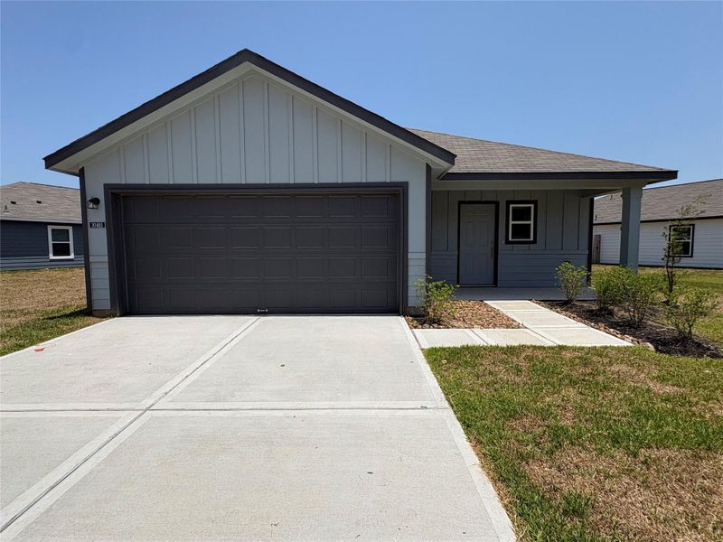 Front exterior of a new home in , Conroe, TX, highlighting curb appeal (Image 1). Front exterior of a new home in , Conroe, TX, highlighting curb appeal (Image 1).