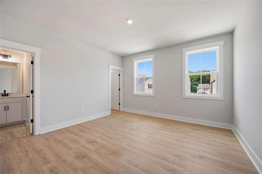 Spacious, unfurnished interior of a new home in The Paddocks at Doc Hughes, Buford (Image 19).