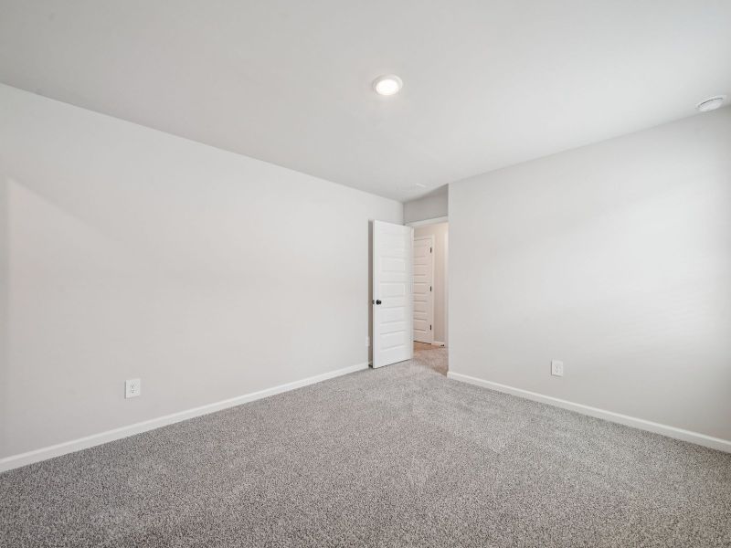 Spacious, unfurnished interior of a new home in Vines at Mill Creek - Estate Series, Braselton (Image 19).