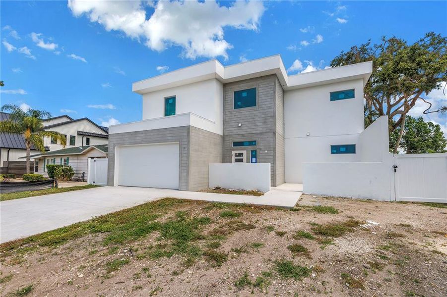 Front exterior of a new home in , Sarasota, FL, highlighting curb appeal (Image 22).
