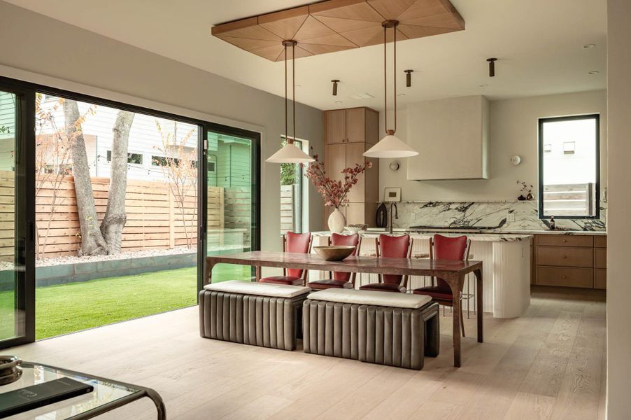 Dining area, creates indoor-outdoor living, wood finished floors throughout the whole house