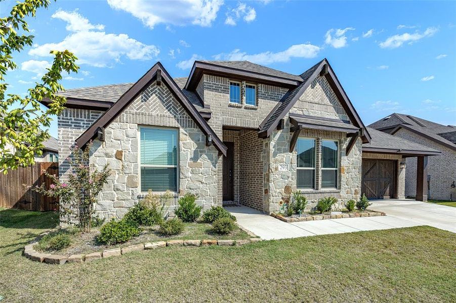 Front exterior of a new home in The Oasis at North Grove 60-70, Waxahachie, TX, highlighting curb appeal (Image 24). Front exterior of a new home in The Oasis at North Grove 60-70, Waxahachie, TX, highlighting curb appeal (Image 24).