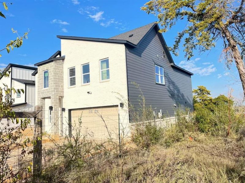 Front exterior of a new home in , Dallas, TX, highlighting curb appeal (Image 12).
