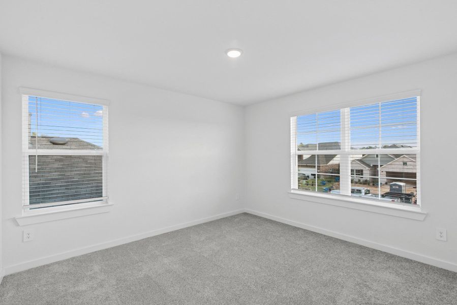 Spacious, unfurnished interior of a new home in Pinewood at Grand Texas, New Caney (Image 22).