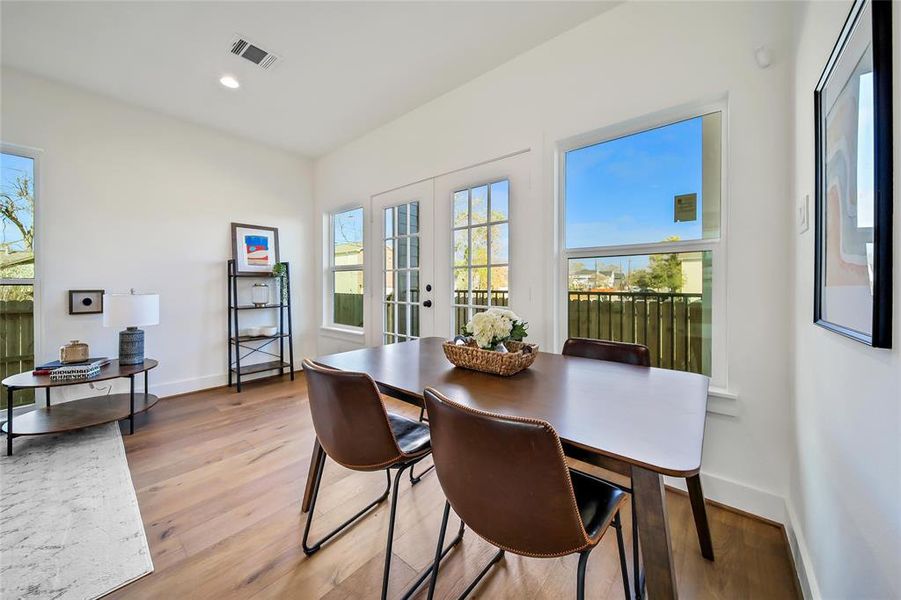 This photo was taken in another staged property with the same finishes and layout. Dining space.