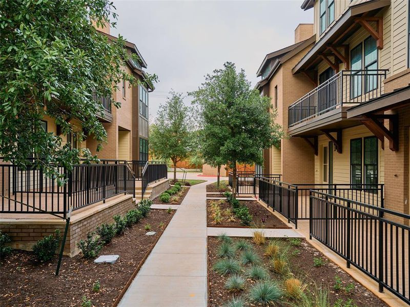 Modern townhome exteriors featuring brick and horizontal siding