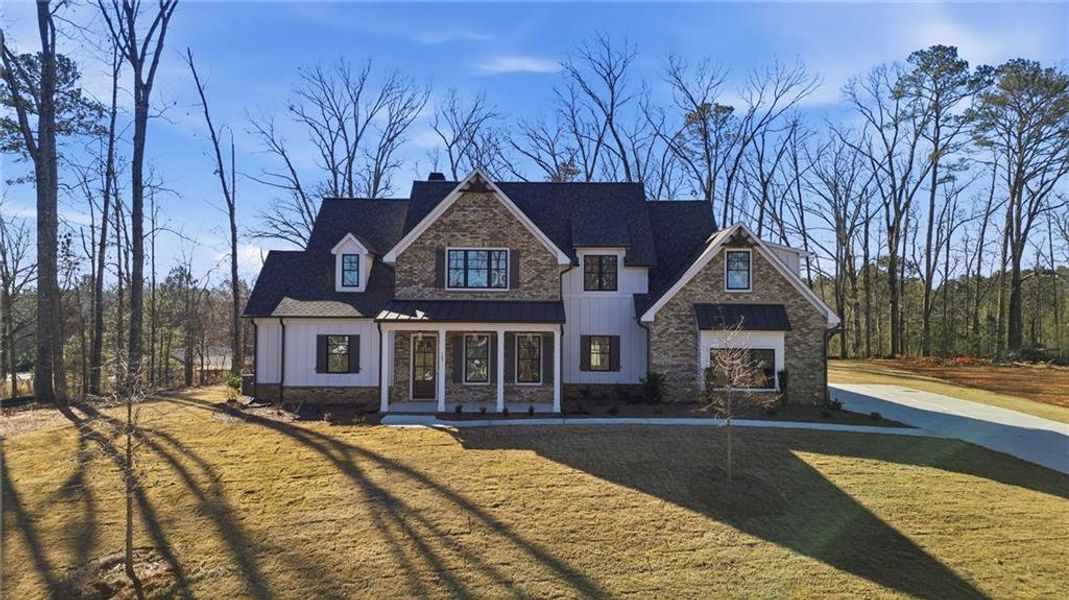 Front exterior of a new home in , Canton, GA, highlighting curb appeal (Image 26). Front exterior of a new home in , Canton, GA, highlighting curb appeal (Image 26).