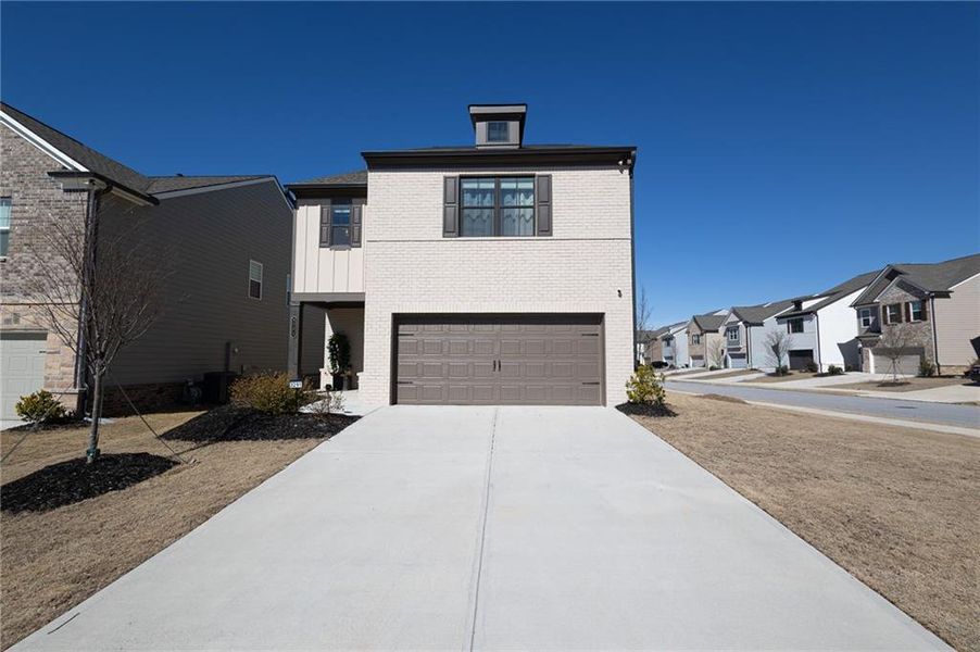 Front exterior of a new home in Westgate Enclave, Loganville, GA, highlighting curb appeal (Image 27).