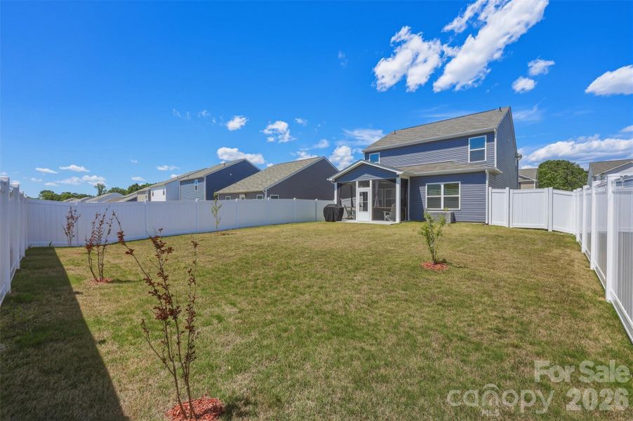 backyard- screened-in porch, extended cement patio, vinyl privacy fence- upgrade added after purchase!