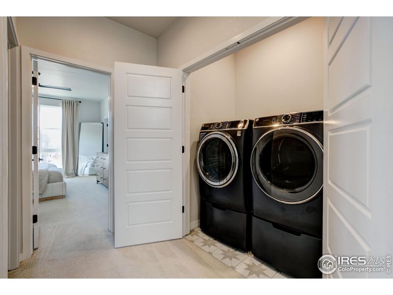 Conveniently located laundry area near the bedrooms