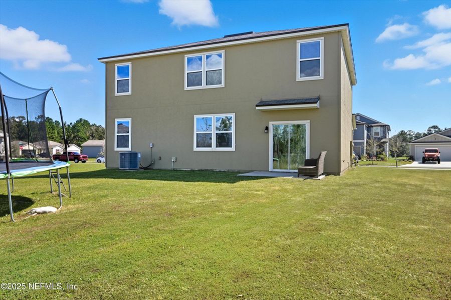 Exterior details and patio area of a home in Cross Creek Express, Green Cove Springs (Image 24).
