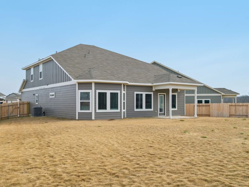 Exterior details and patio area of a home in Riverbend at Double Eagle - Boulevard Collection, Cedar Creek (Image 3). Exterior details and patio area of a home in Riverbend at Double Eagle - Boulevard Collection, Cedar Creek (Image 3).