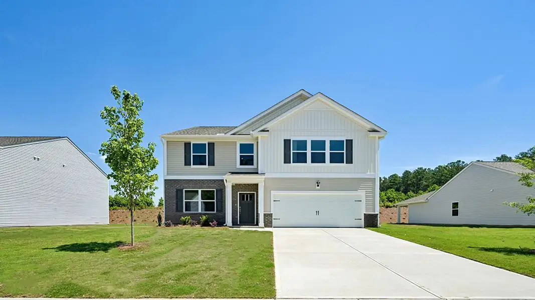 Front exterior of a new home in Cross Creek, Spring Lake, NC, highlighting curb appeal (Image 2). Front exterior of a new home in Cross Creek, Spring Lake, NC, highlighting curb appeal (Image 2).