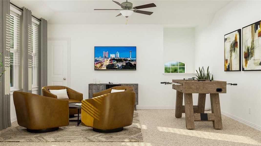 Living area with ceiling fan and light colored carpet