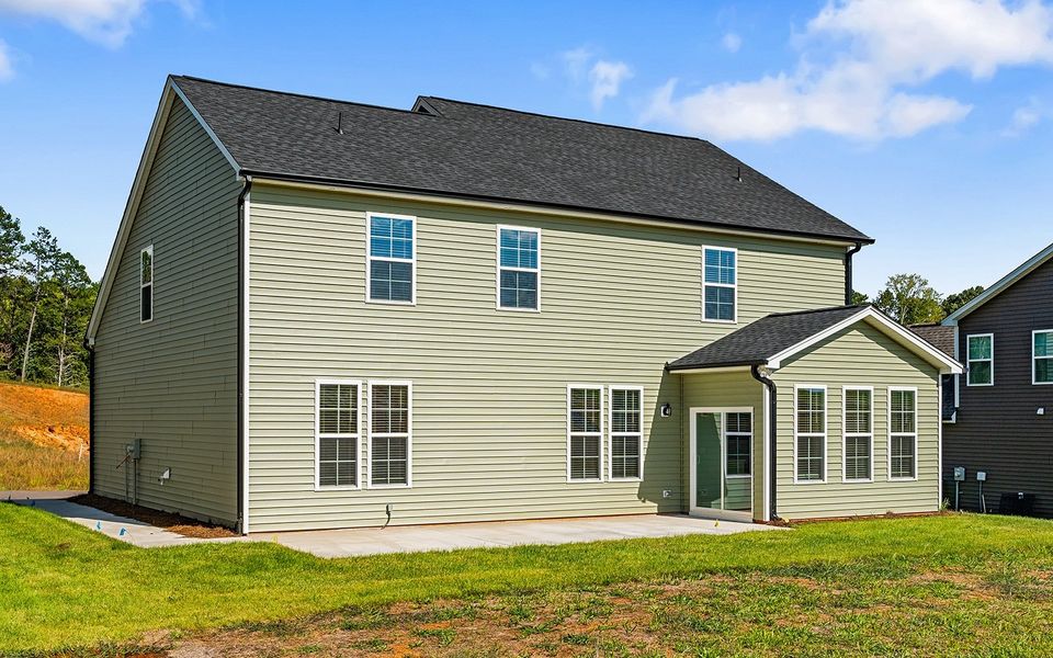Front exterior of a new home in Brooke Hill, Lewisville, NC, highlighting curb appeal (Image 27).