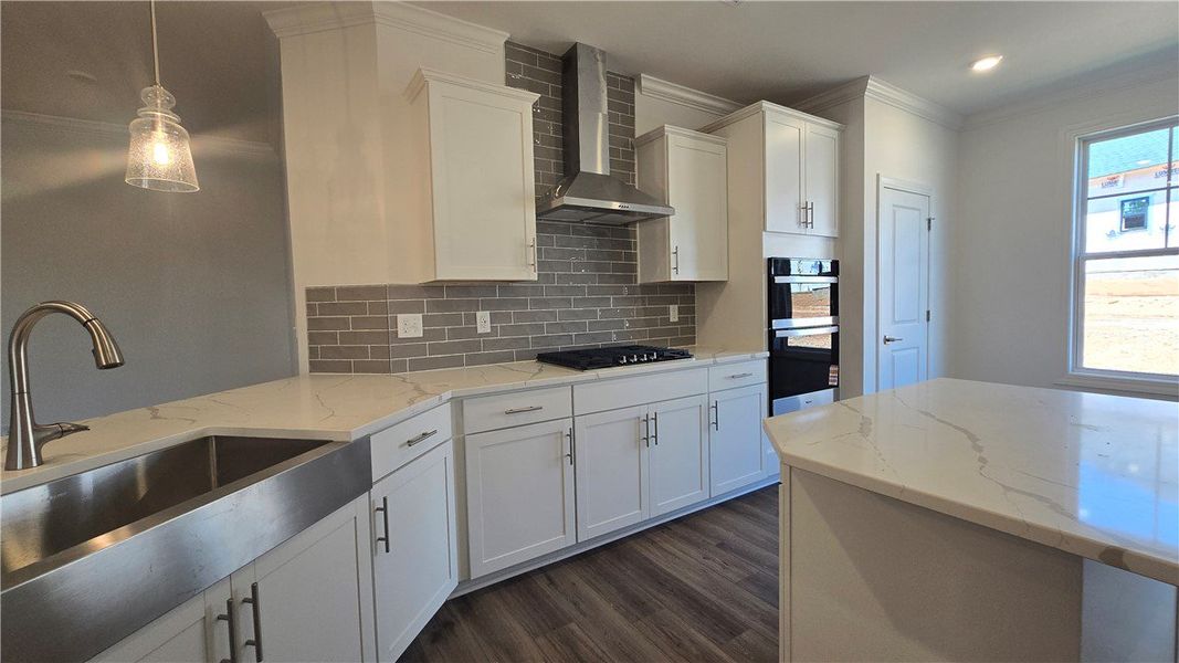A well-appointed kitchen features stainless steel