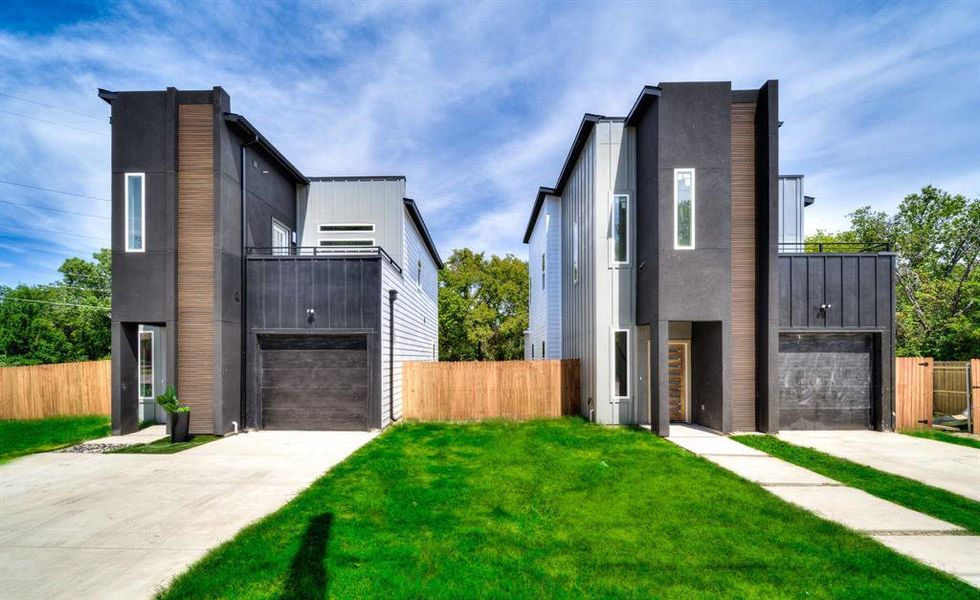 Modern home with a balcony, a garage, and a front lawn