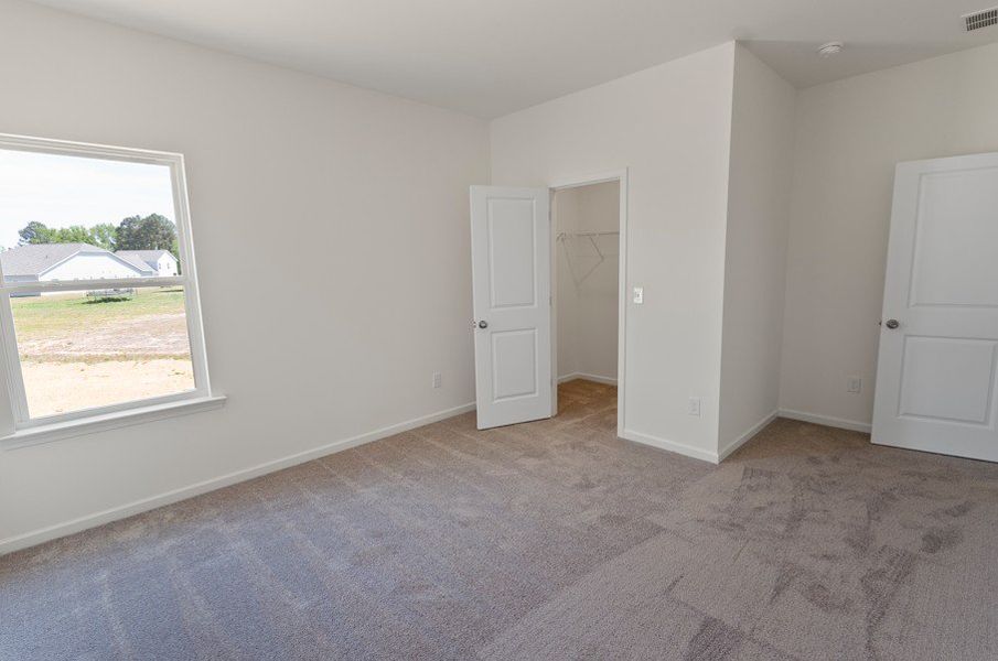 Spacious, unfurnished interior of a new home in The Exchange, Vass (Image 13).