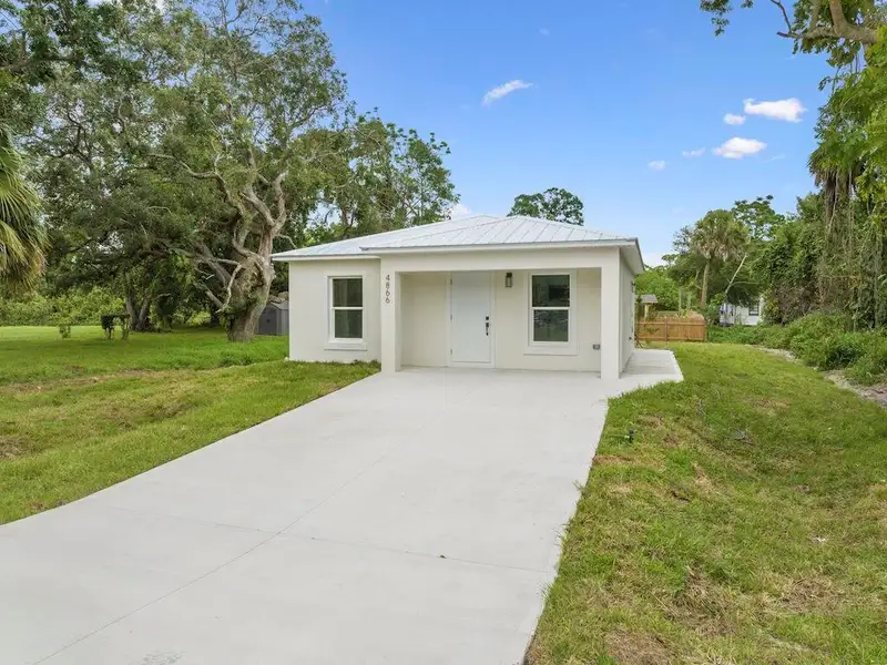 Front exterior of a new home in , Vero Beach, FL, highlighting curb appeal (Image 2). Front exterior of a new home in , Vero Beach, FL, highlighting curb appeal (Image 2).