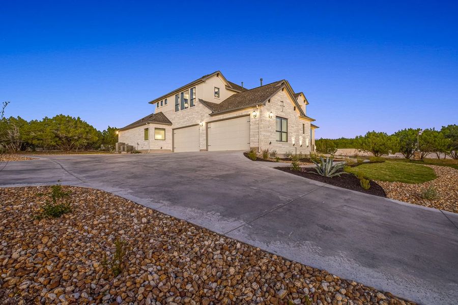 Representative exterior photo of a completed home built from the Madera II by Giddens Homes in Scofield Farms Estates, Georgetown, TX (Image 29).