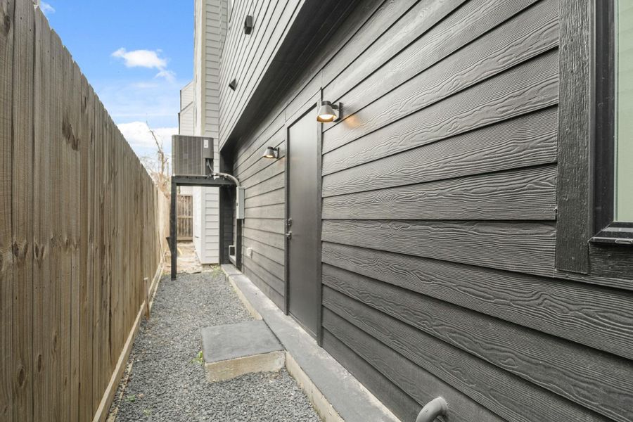 Another view of the backyard with access to the third bedroom.